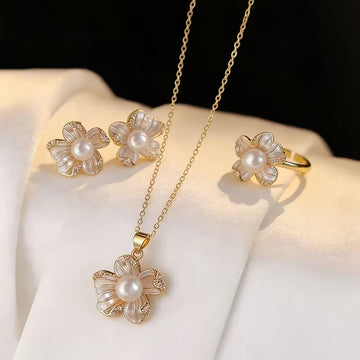 A Set of Three Pieces Including a Necklace, Ring, And Earrings Designed in a Light Luxury French Style with Faux Pearl Flowers