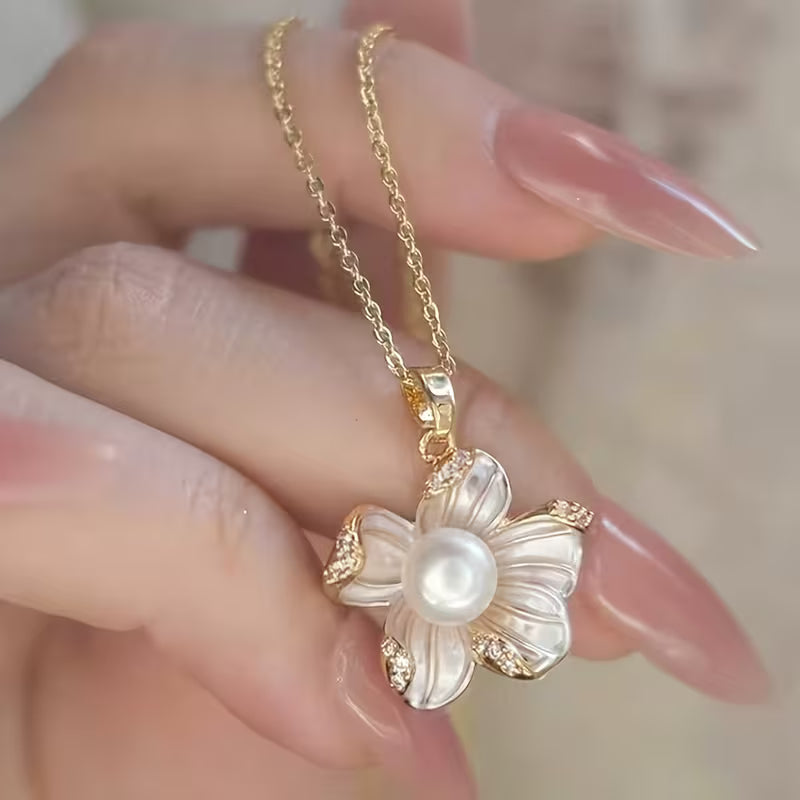A Set of Three Pieces Including a Necklace, Ring, And Earrings Designed in a Light Luxury French Style with Faux Pearl Flowers