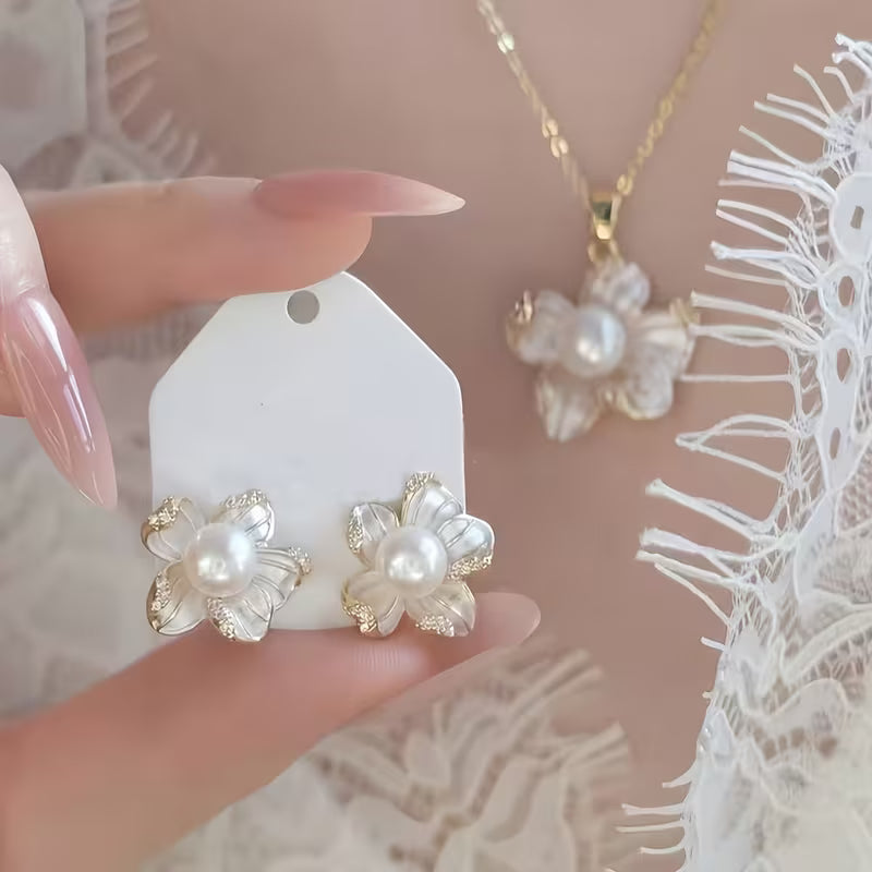 A Set of Three Pieces Including a Necklace, Ring, And Earrings Designed in a Light Luxury French Style with Faux Pearl Flowers